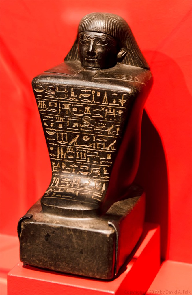 Here is a photo of the statue of Keret at the National Geographic Museum.  Keret was overseer of the royal herem.  He lived during the 18th Dynasty and the statue dates to Amenhotep II or Thutmosis IV.